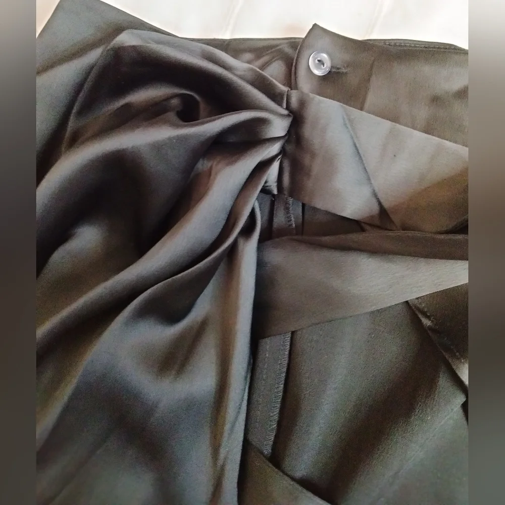 Gorgeous black wrap around skirt. New with tags! Size 34